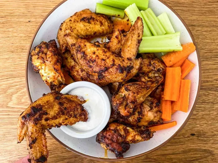 What Step Helps Chicken Wings Cook Evenly and Brown Well